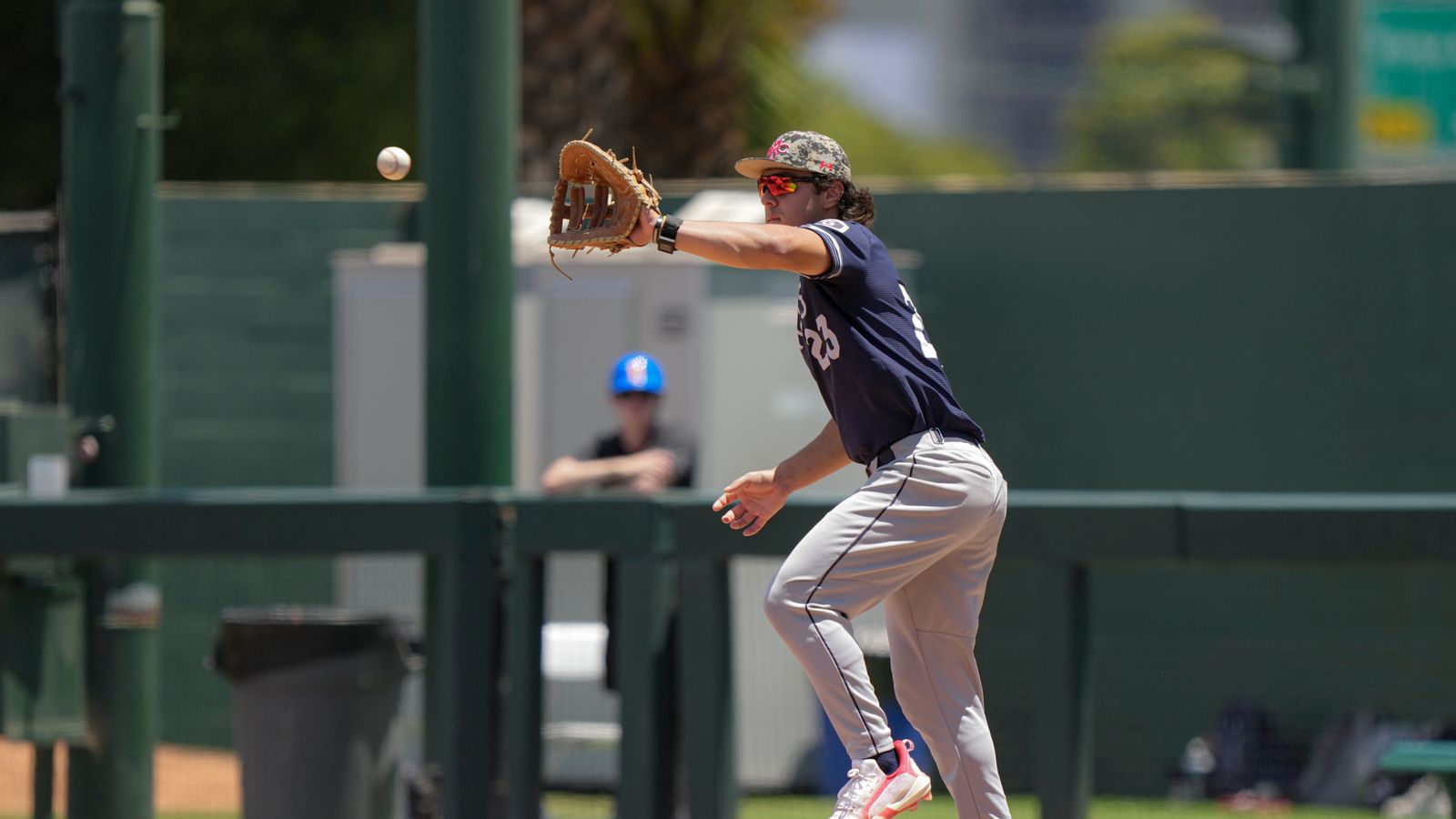 Makoa Sniffen fields a throw to first base