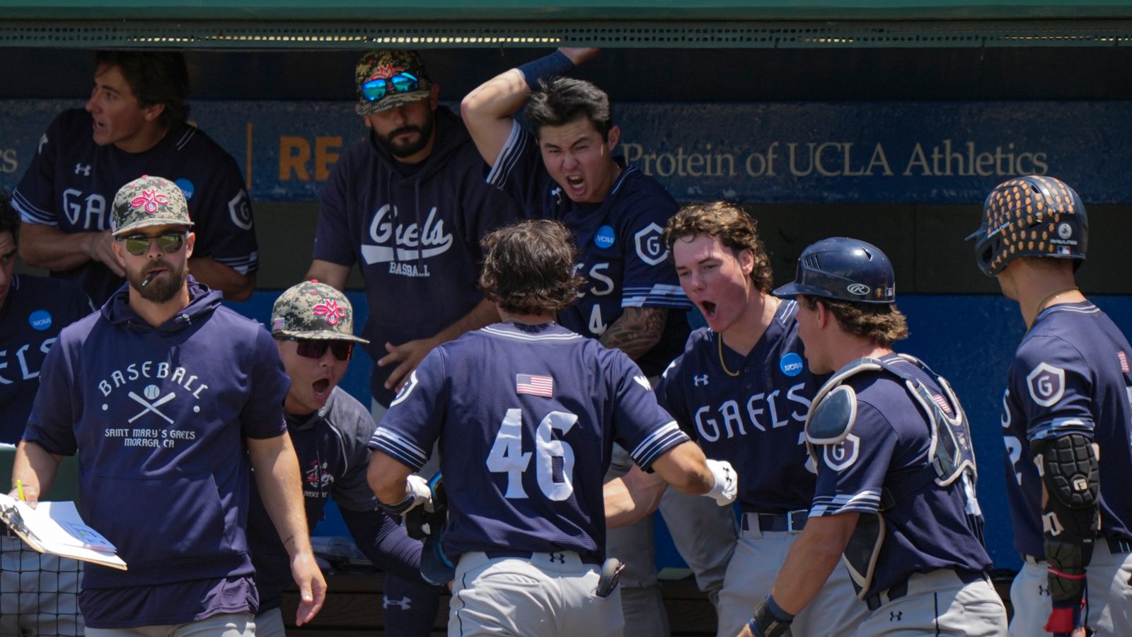 Jacob Johnson celebrates a homer with teammates