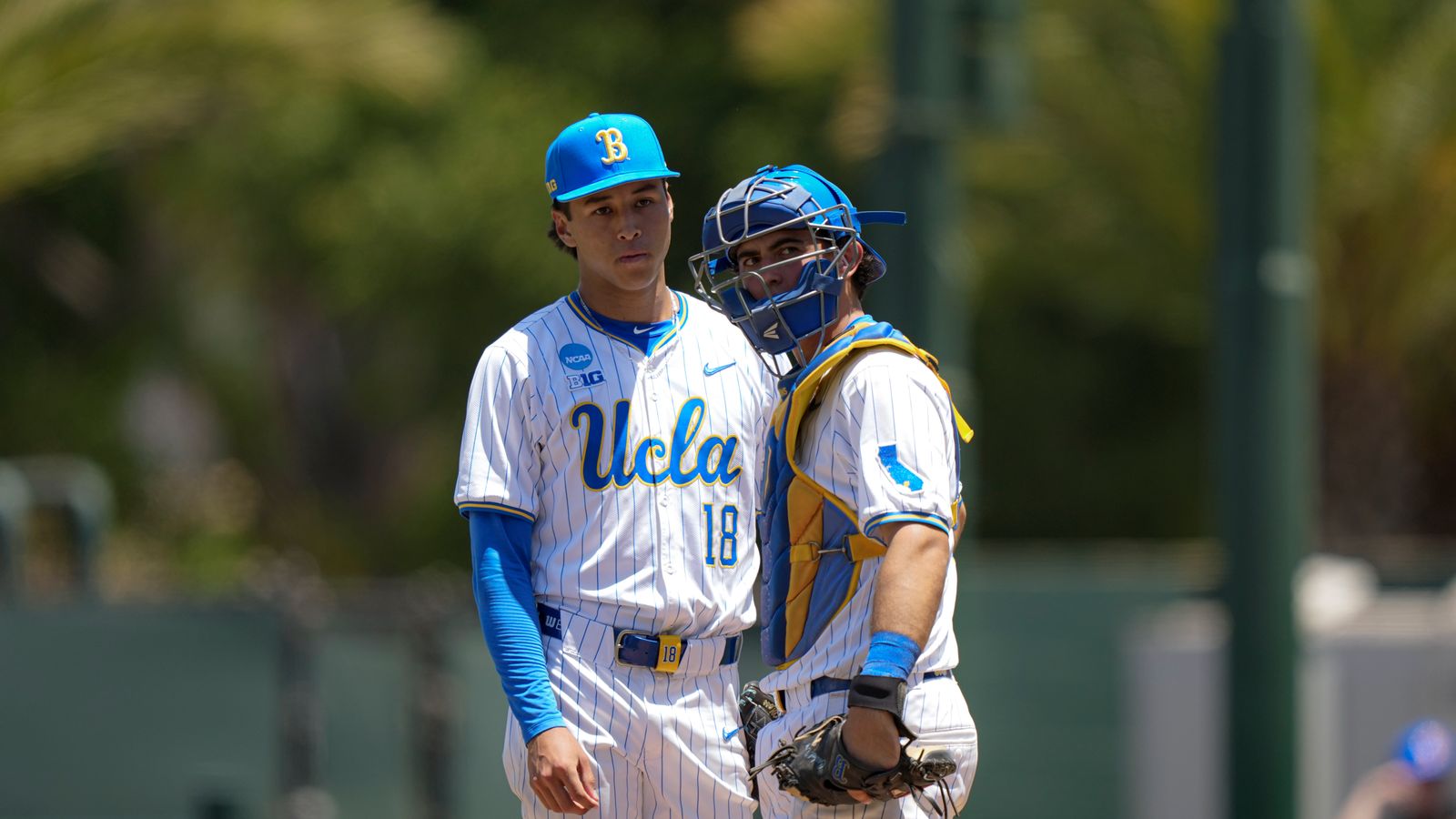 Wylan Moss and Cashel Dugger discuss strategy on mound