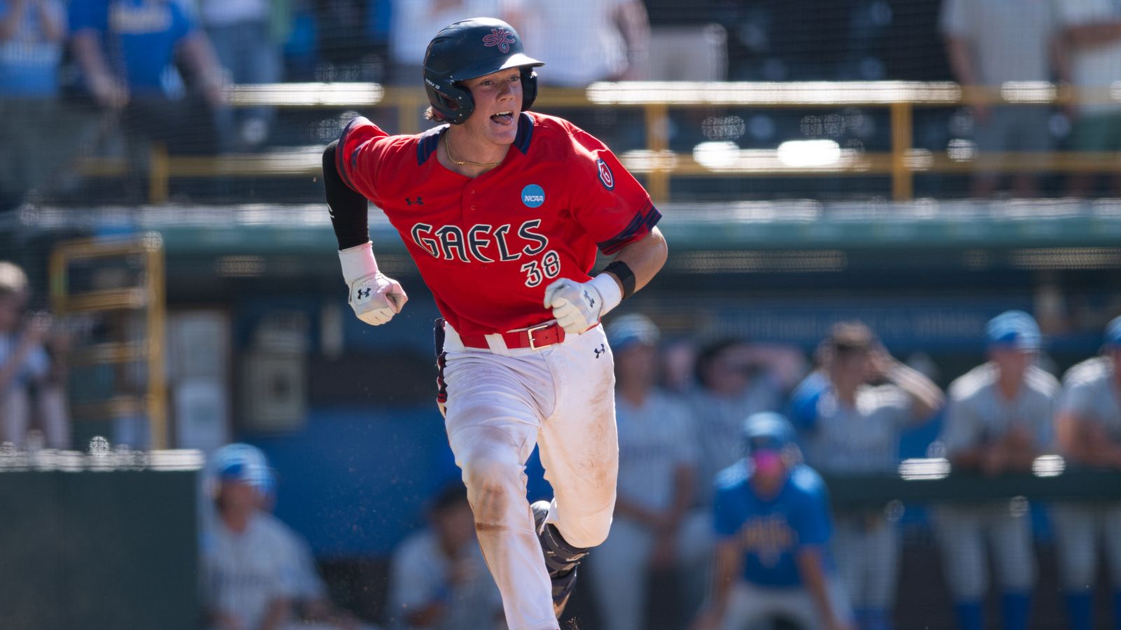 Ian Armstrong runs to first base in NCAA regional game