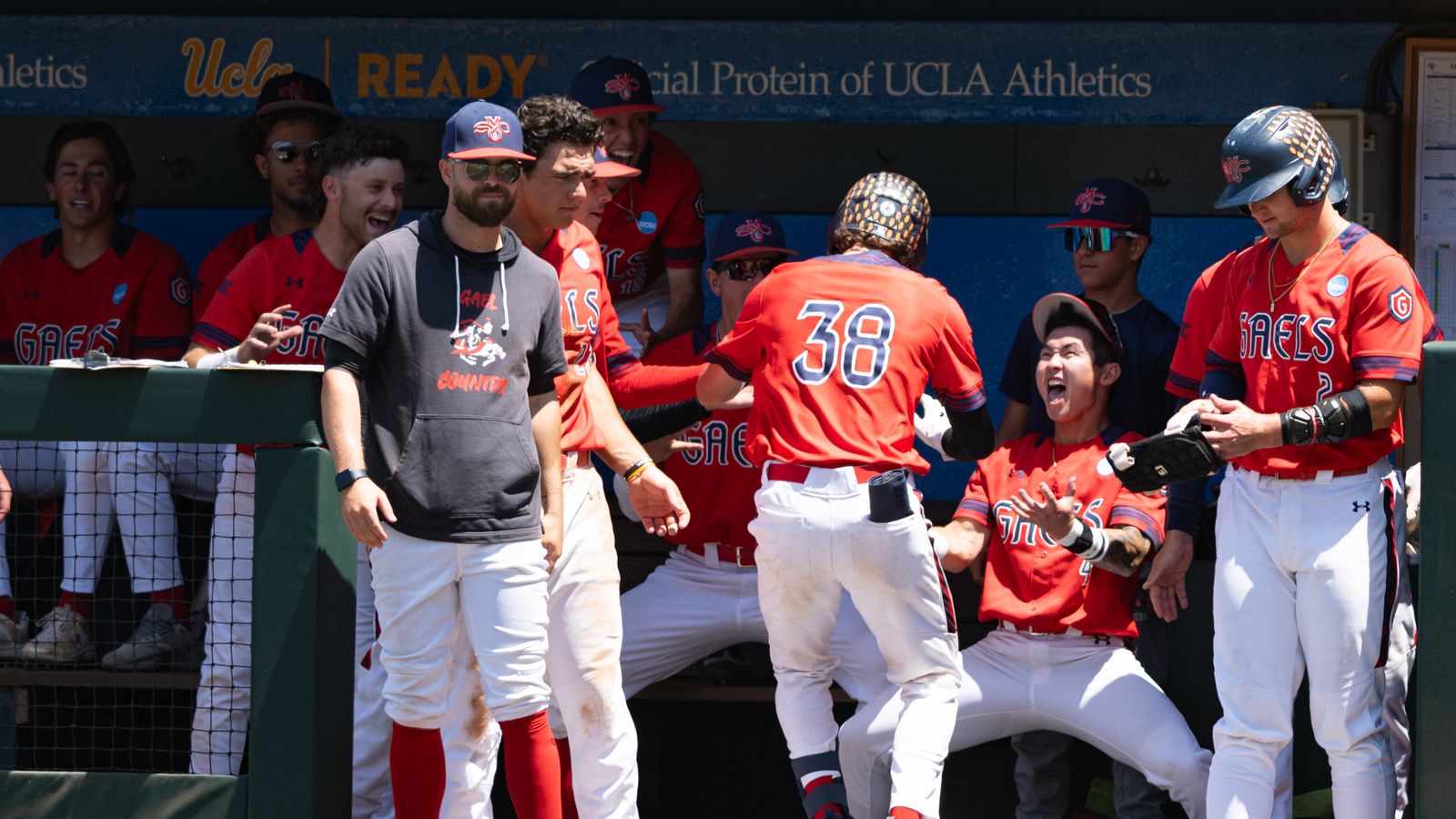 Ian Armstrong celebrates a homerun with teammates