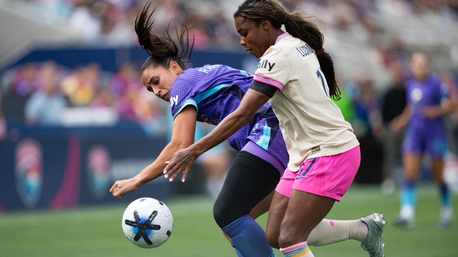 Ludmila in a tight possession battle during NWSL game