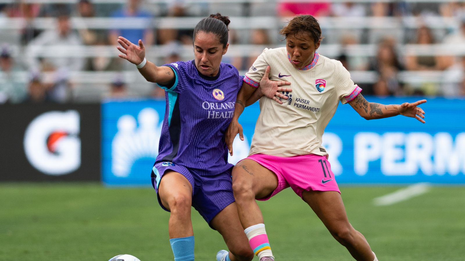 Gia Corley fights for possession in midfield