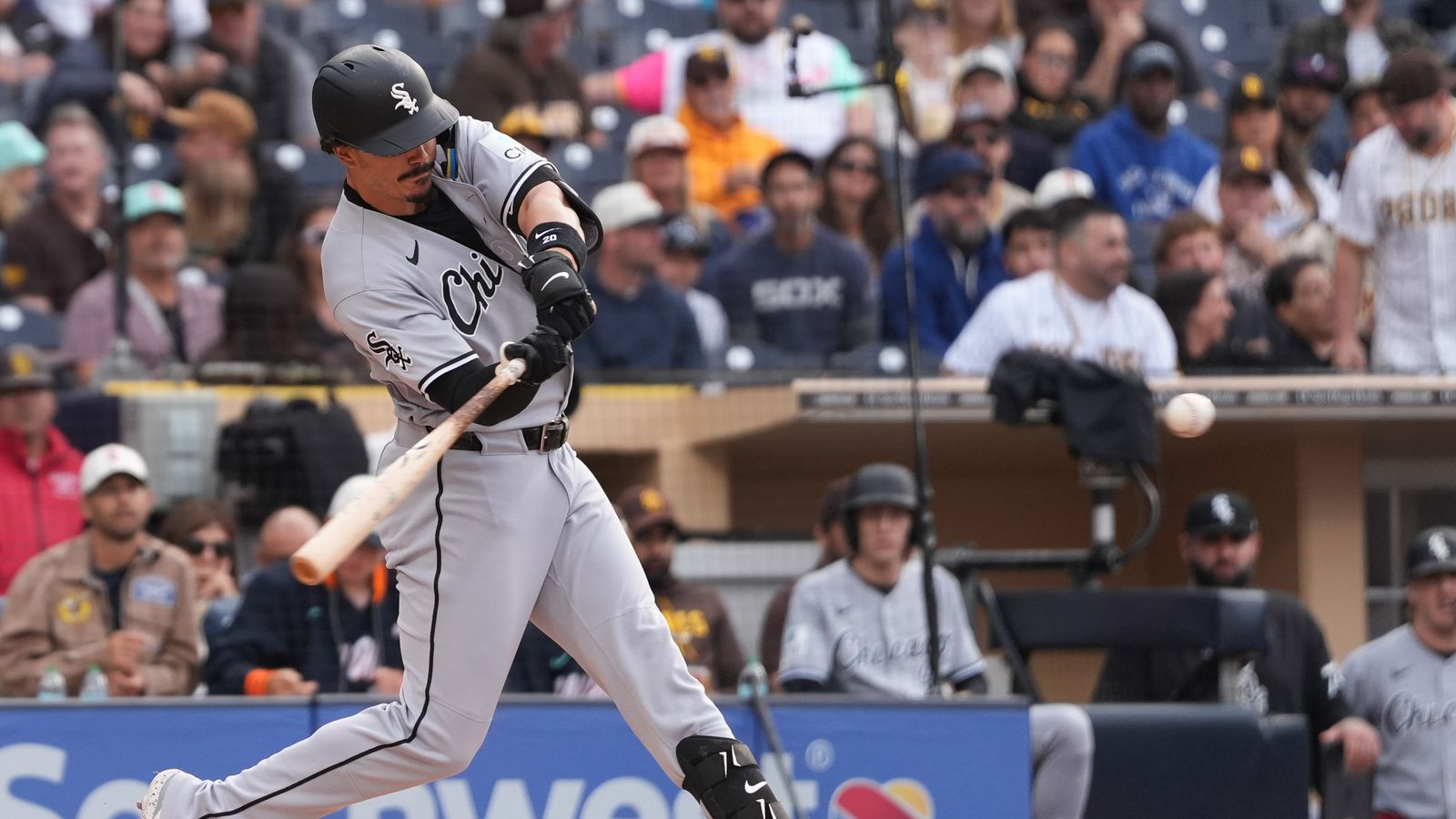 White Sox third baseman Miguel Vargas (20) swings and misses
