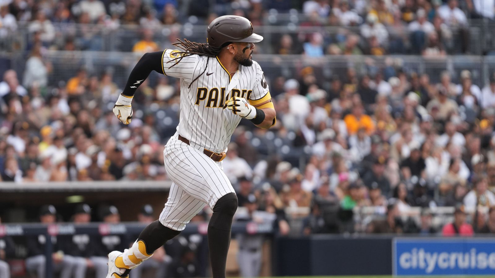 Padres right fielder Fernando Tatis Jr. (23) runs to first base