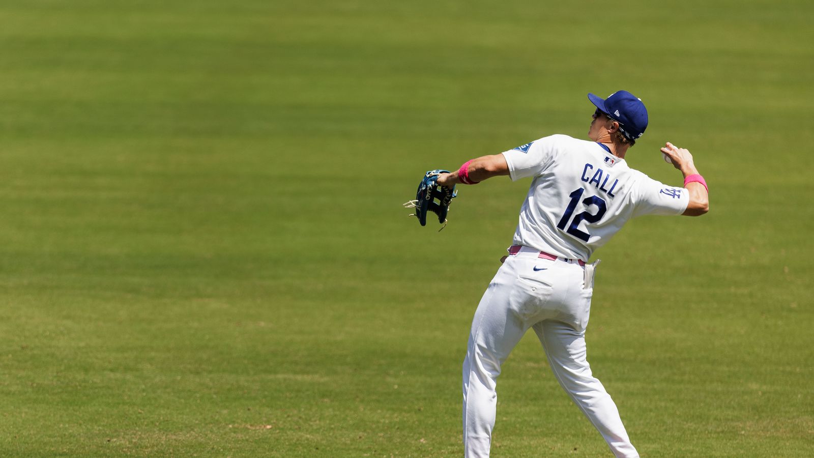 Alex Call throws a ball to fans at Dodgers Stadium.