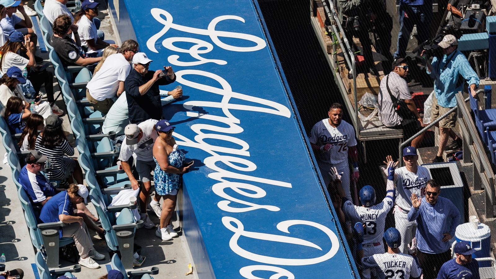 Max Muncy celebrated by fans after his home-run.
