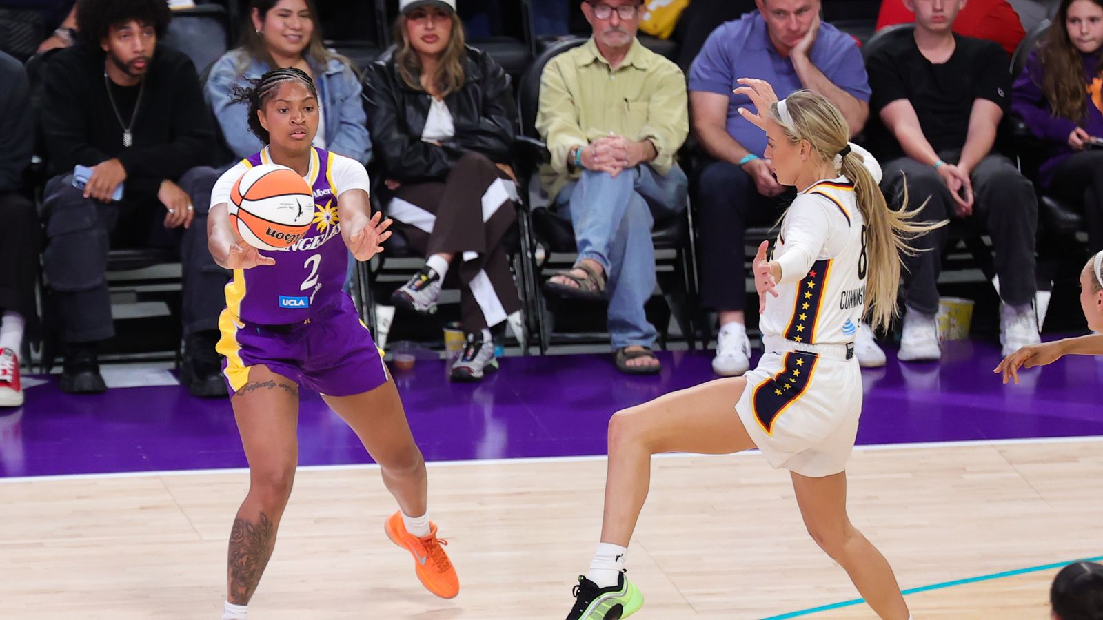 Chance Gray passes the ball in WNBA game against Fever
