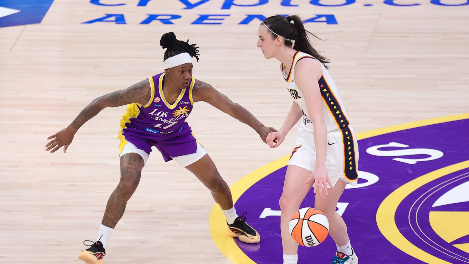 Erica Wheeler defends against Caitlin Clark in WNBA action