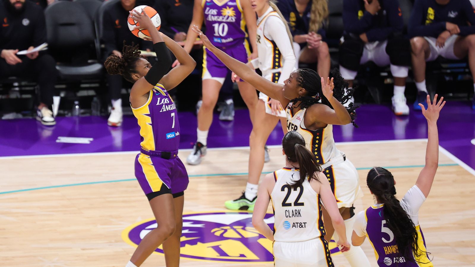 Ariel Atkins shoots during a WNBA game against Fever