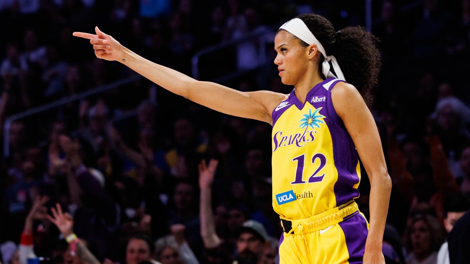 Rae Burrell celebrates a three-pointer against the Tempo.