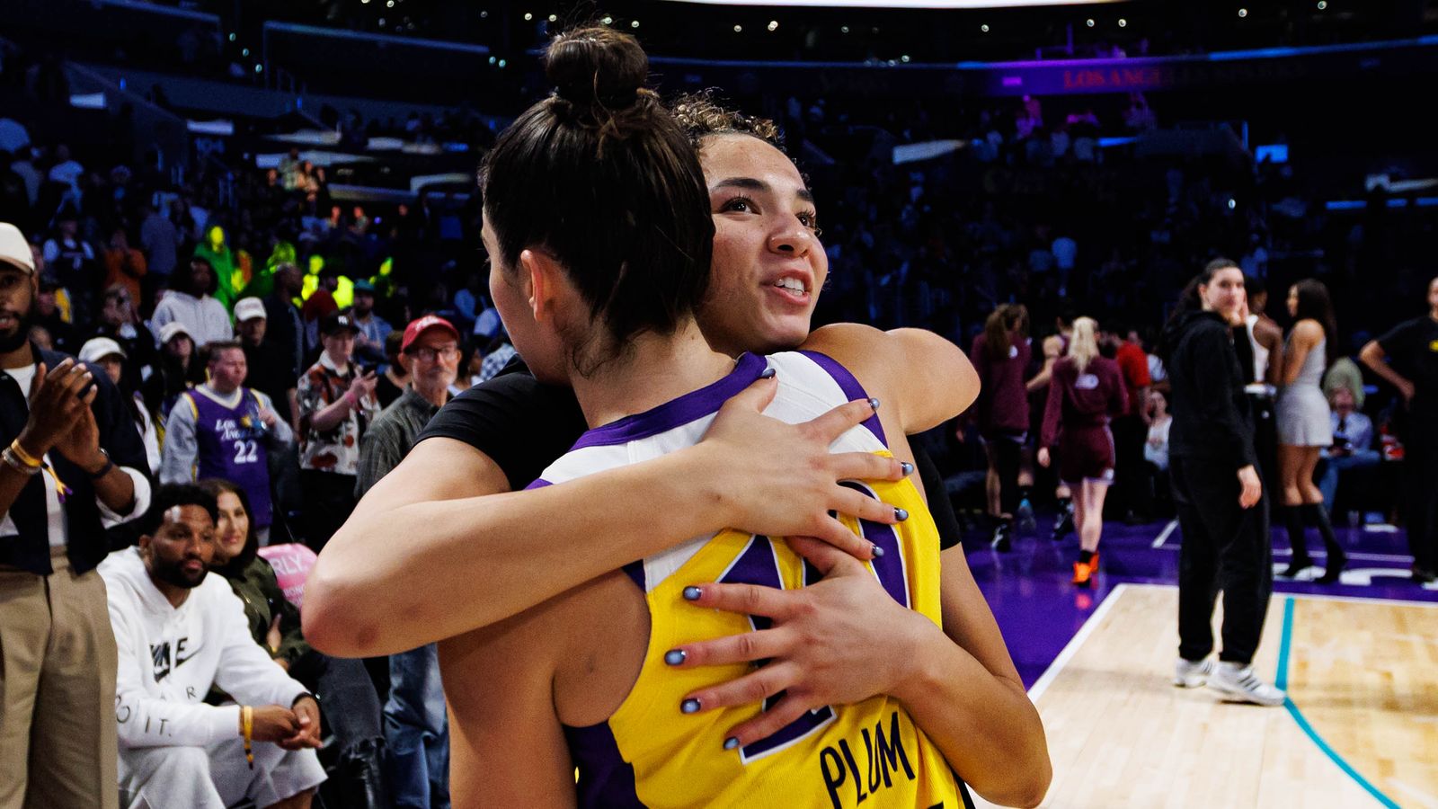 Kelsey Plum hugs Kiki Rice post-game at Crypto.com Arena.