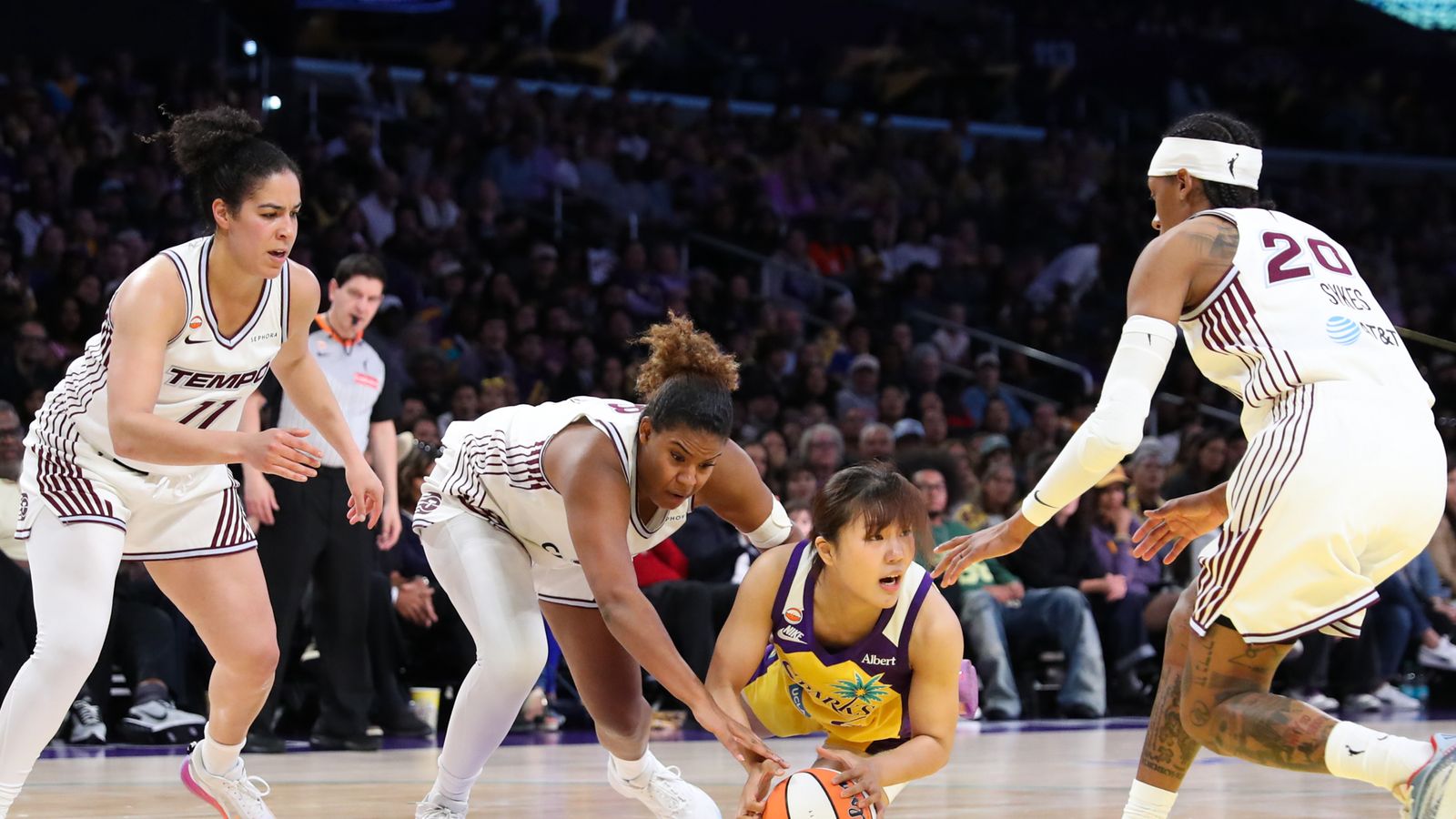 Jihyun Park dives for the ball in WNBA game vs. Toronto Tempo