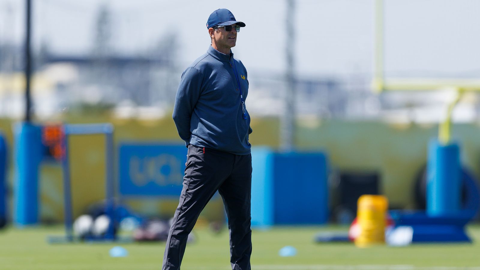 Jim Harbaugh watches Chargers' training at The Bolt