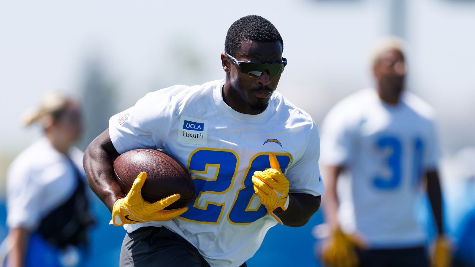 Kimani Vidal #28 runs with the ball at Chargers' workout