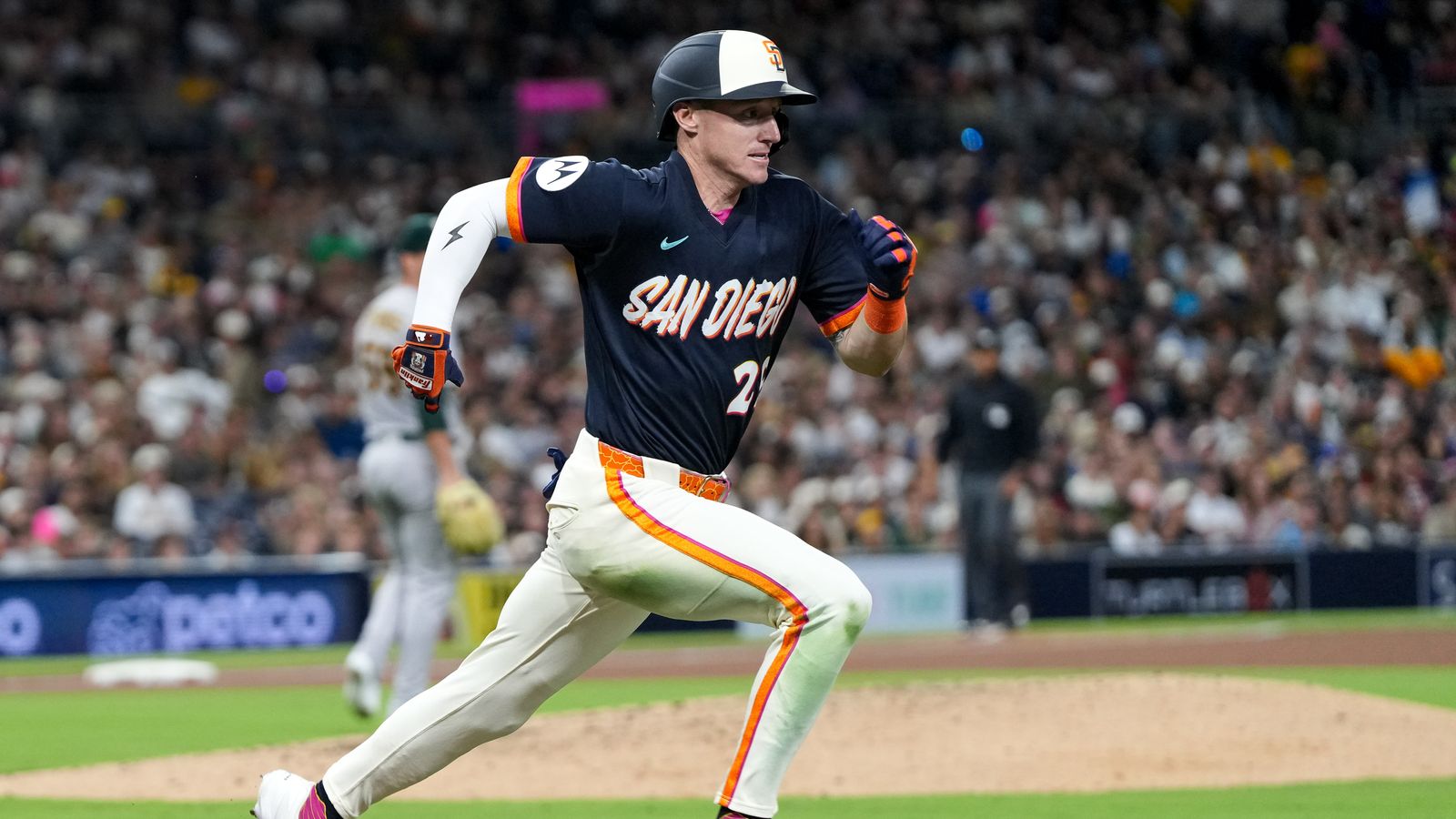 Bryce Johnson runs to first base in Padres-Athletics game.