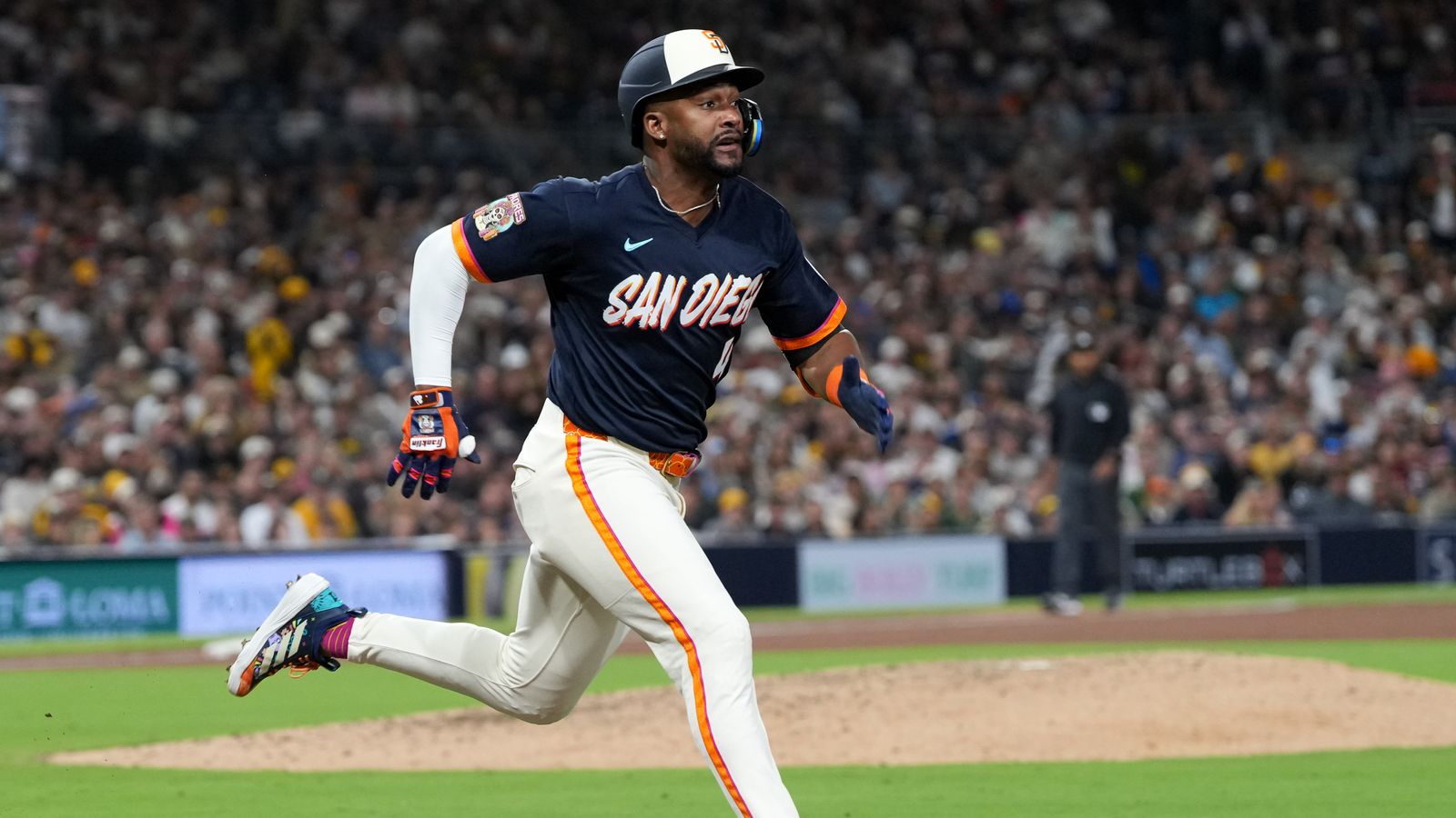 Miguel Andujar runs to first base during an MLB game.