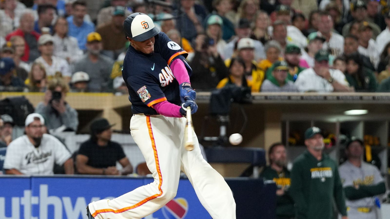 Manny Machado hits the ball in Padres vs Athletics game.
