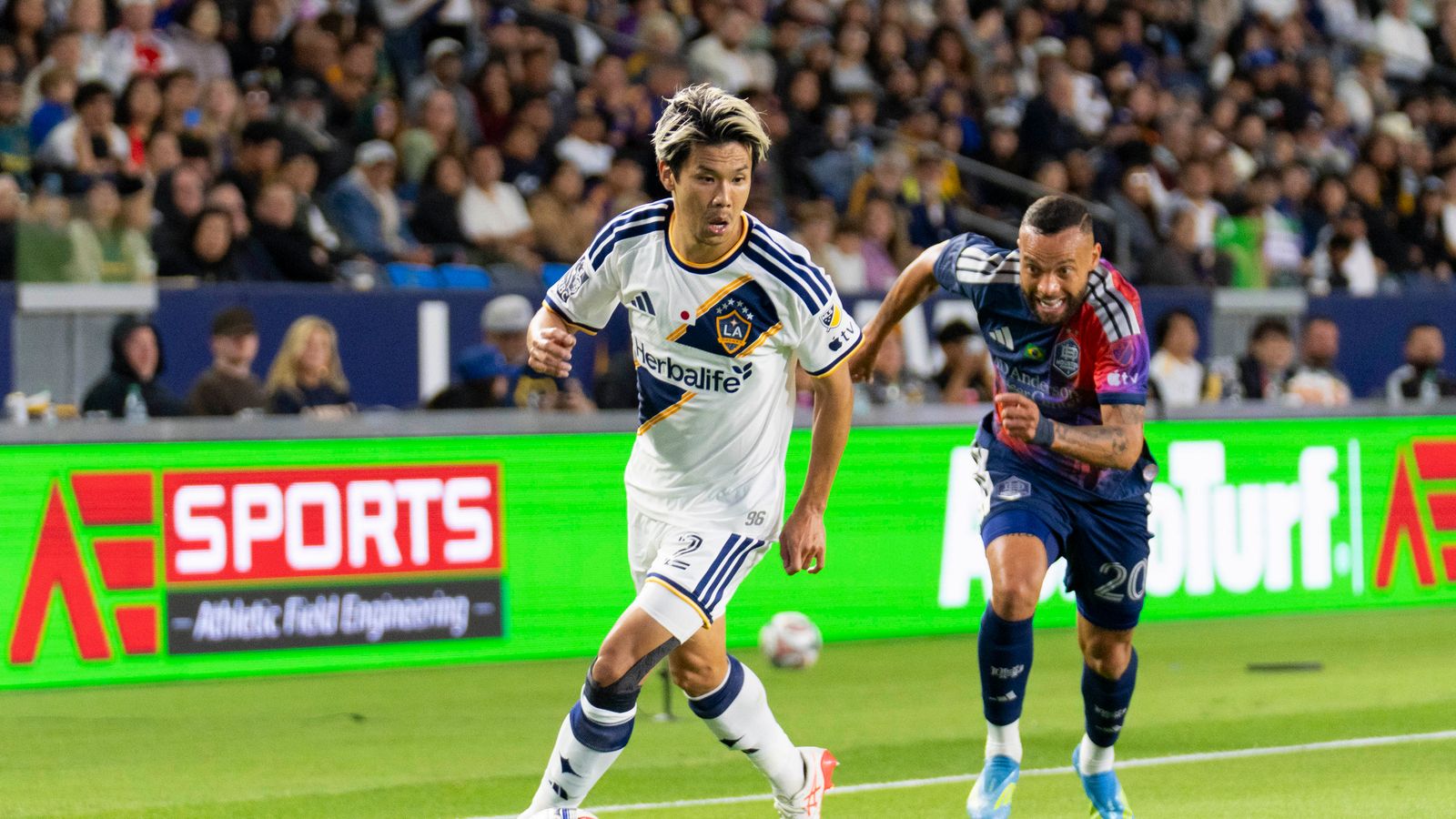 Miki Yamane outpaces defender in LA Galaxy's MLS game