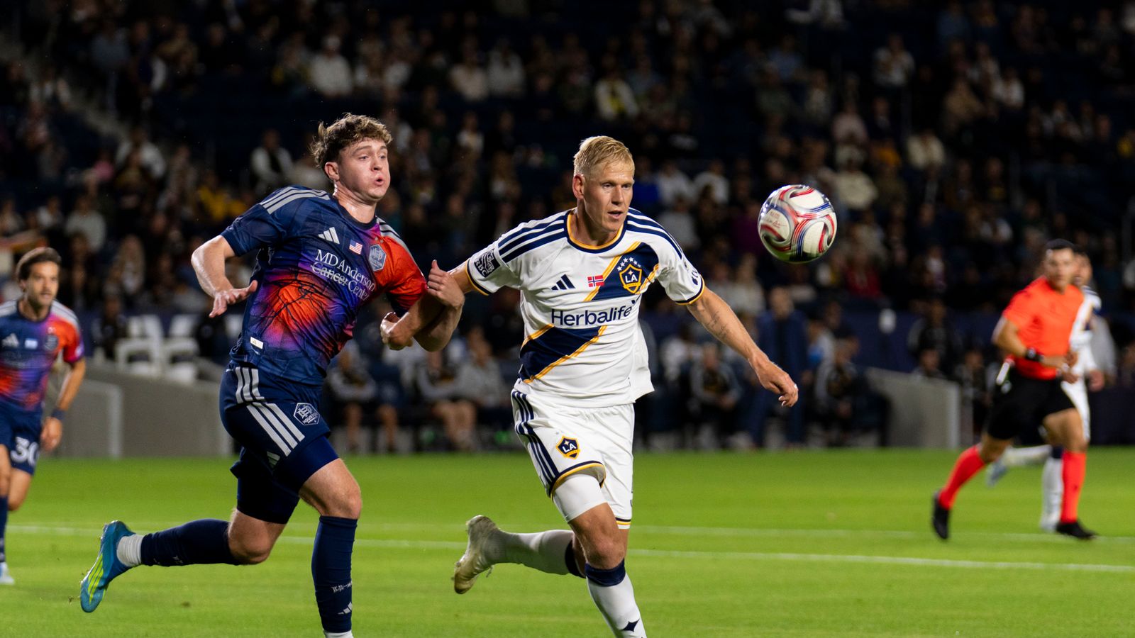Jakob Glesnes fights for position in Galaxy vs Dynamo match