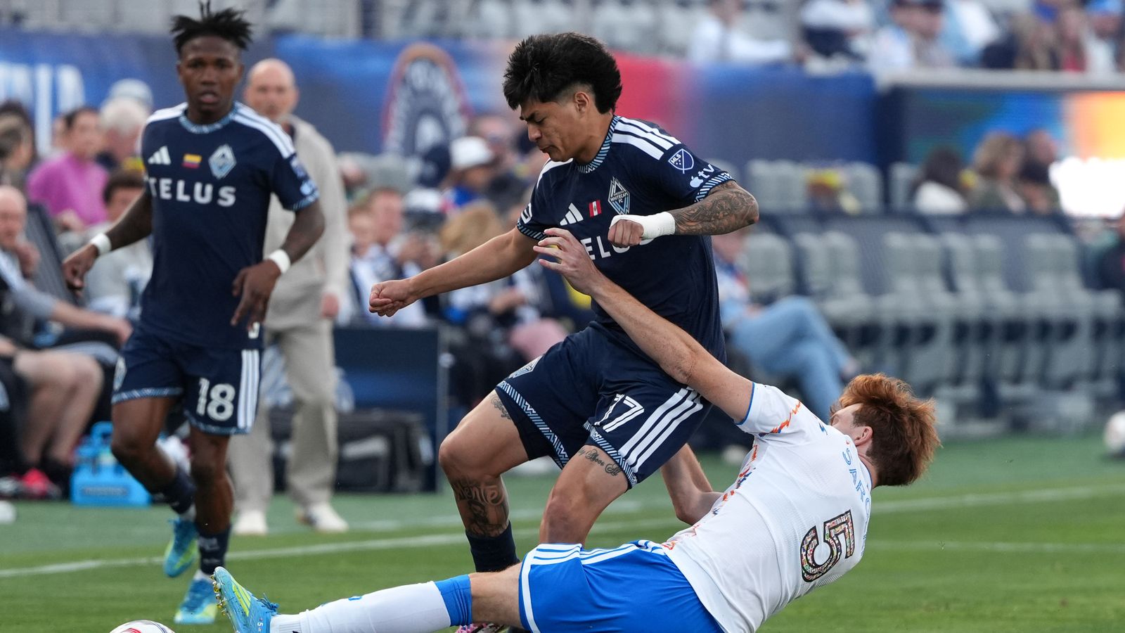 Kieran Sargeant slides for the ball in MLS match against Whitecaps