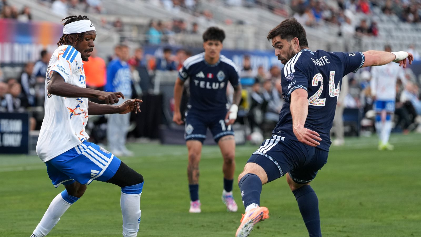 Manu Duah dribbles past Brian White in competitive MLS clash