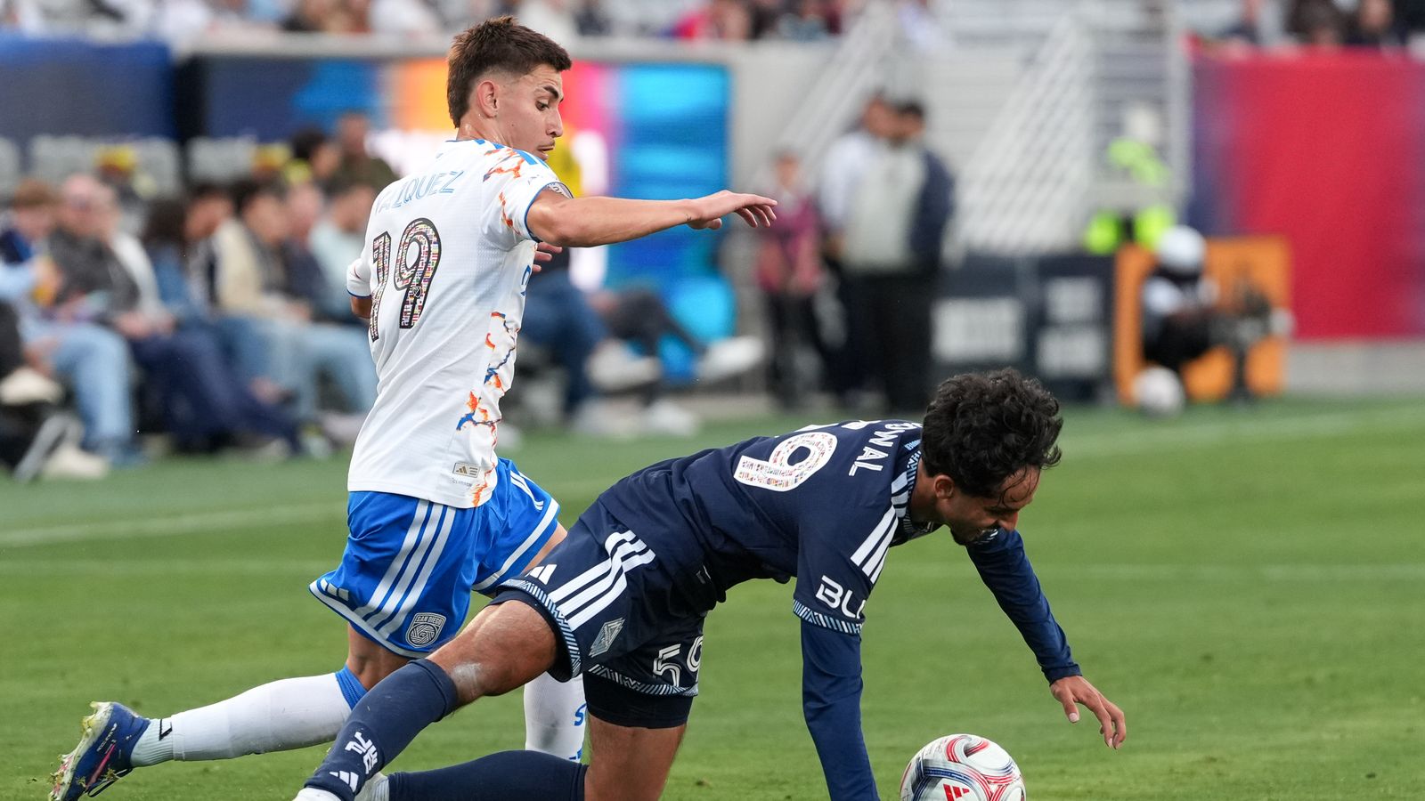 David Vazquez fights for possession in MLS soccer match