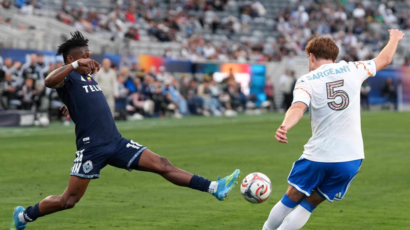 Kieran Sargeant kicks the ball up field in MLS game