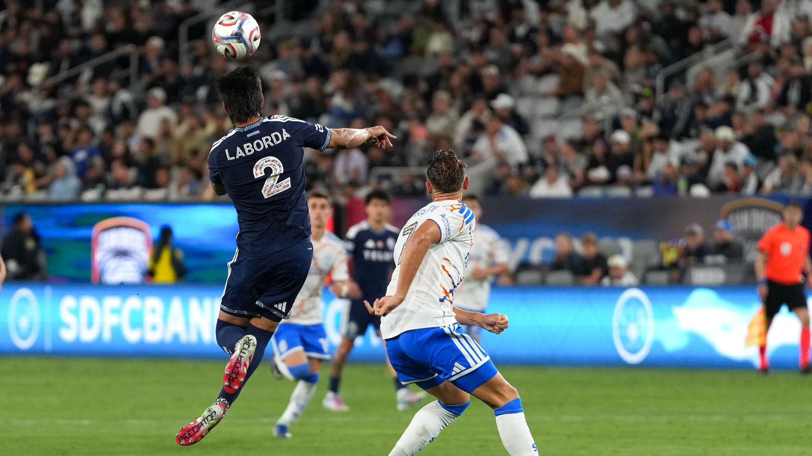 Mathías Laborda heads the ball in MLS match
