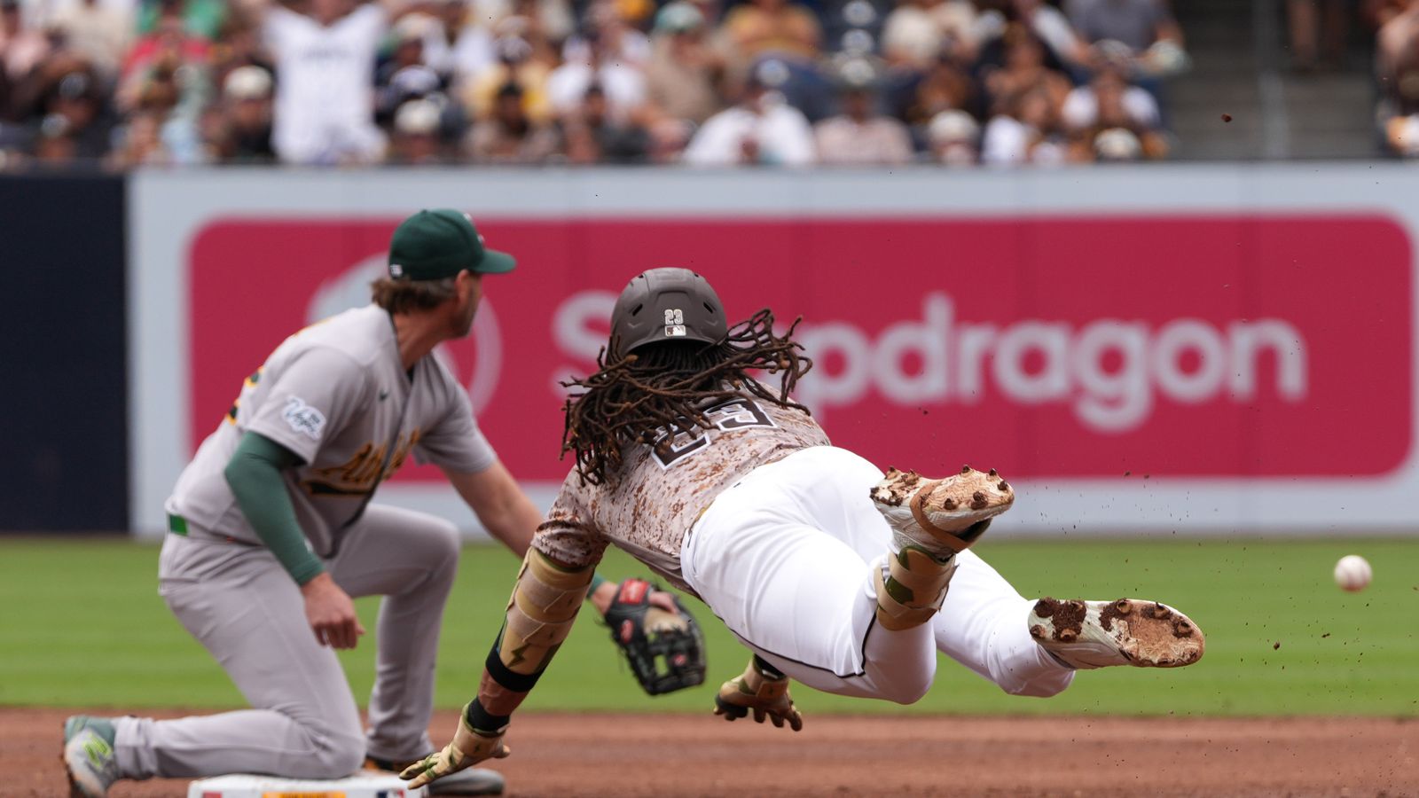 Fernando Tatis Jr. slides to second base