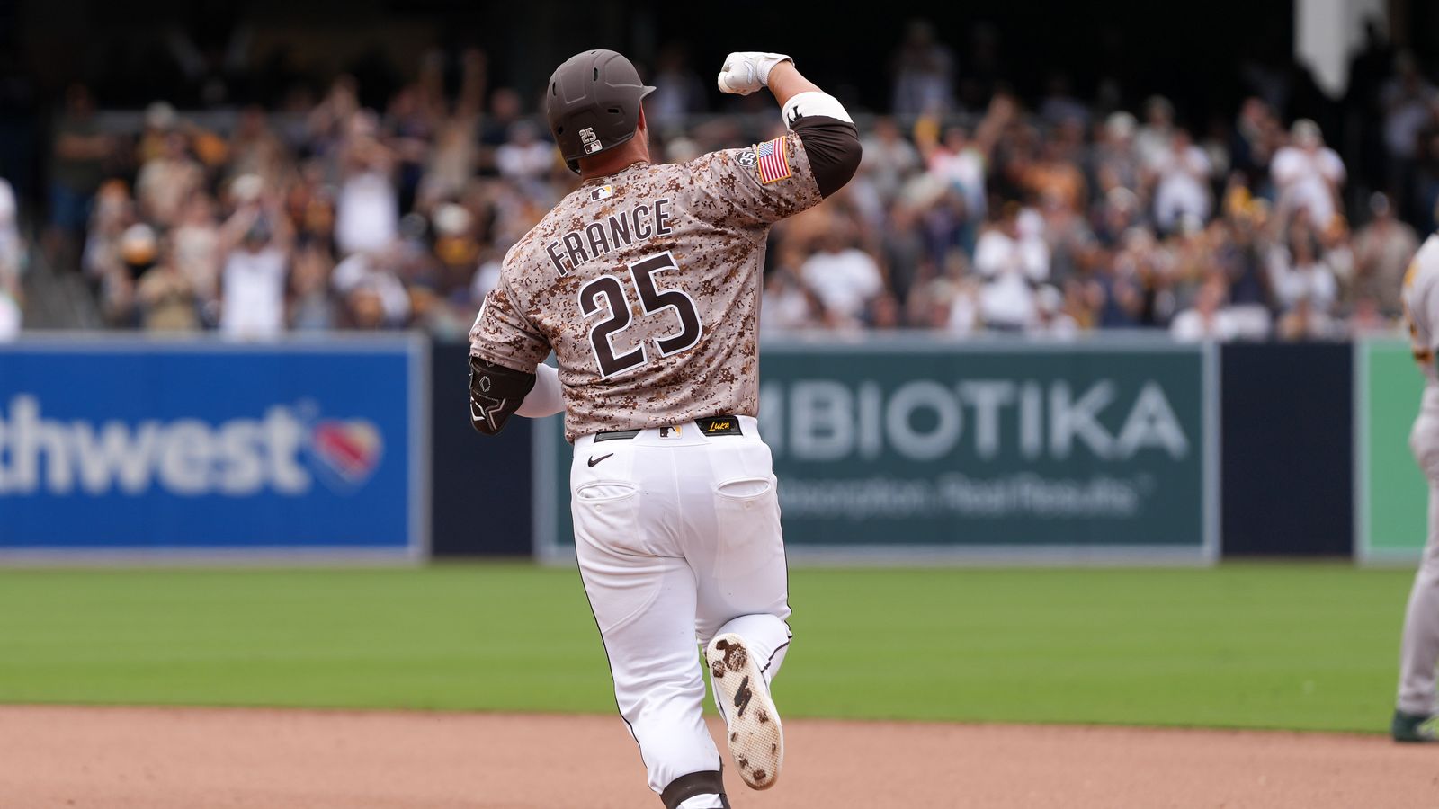 Ty France celebrates a home run