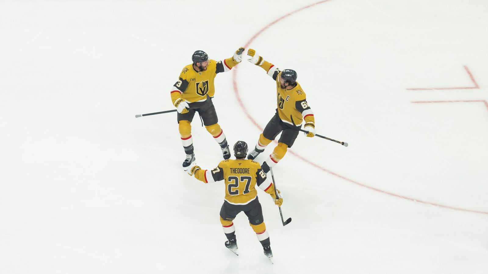 McNabb and Theodore celebrate with Stone after his goal in game 4