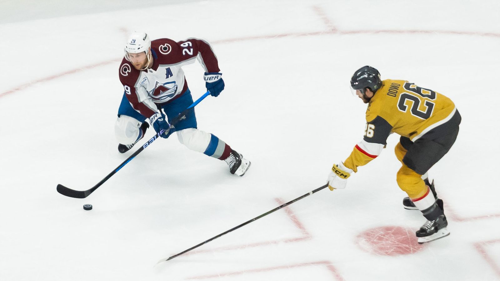 Nathan MacKinnon strategizes a pass in NHL semifinals game 4