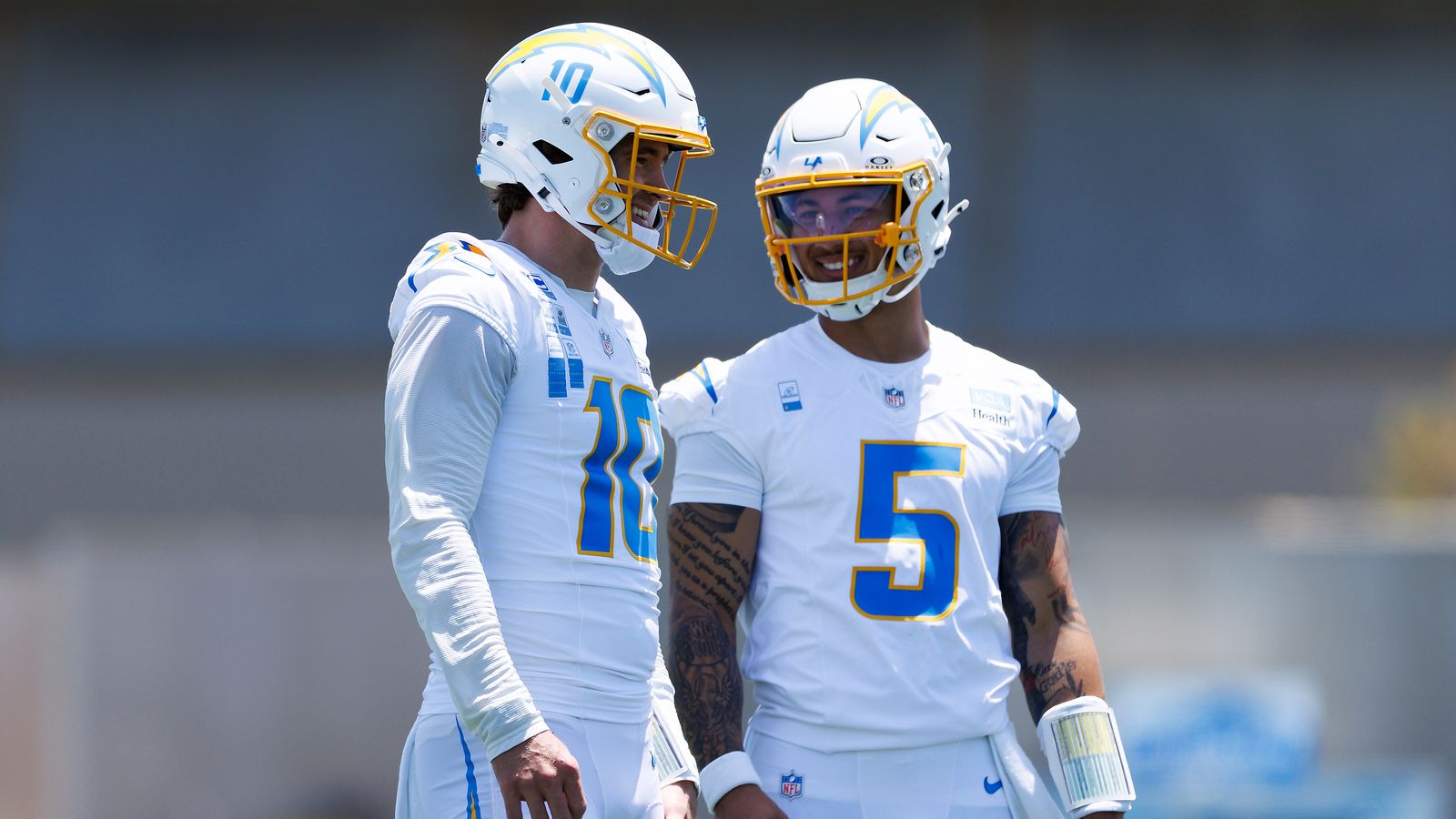 Justin Herbert and Trey Lance share a laugh at Chargers OTA.