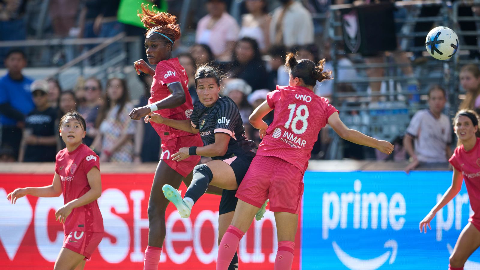 Emily Sams #6 jumps for a corner kick against NC Courage
