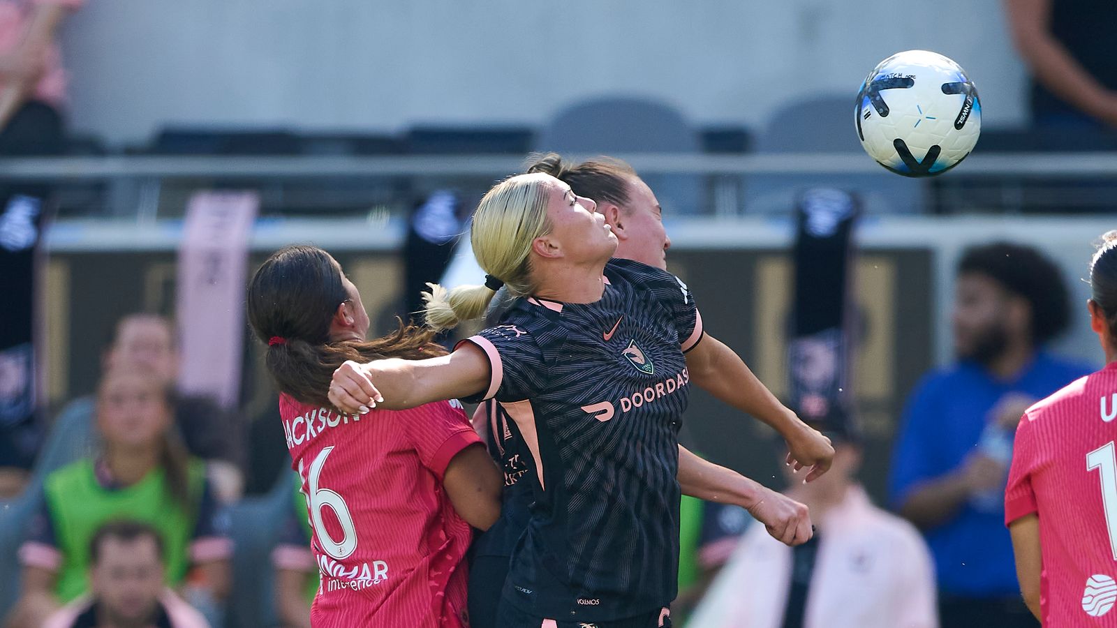 Riley Tiernan #33 in a tussle for the ball during NWSL game