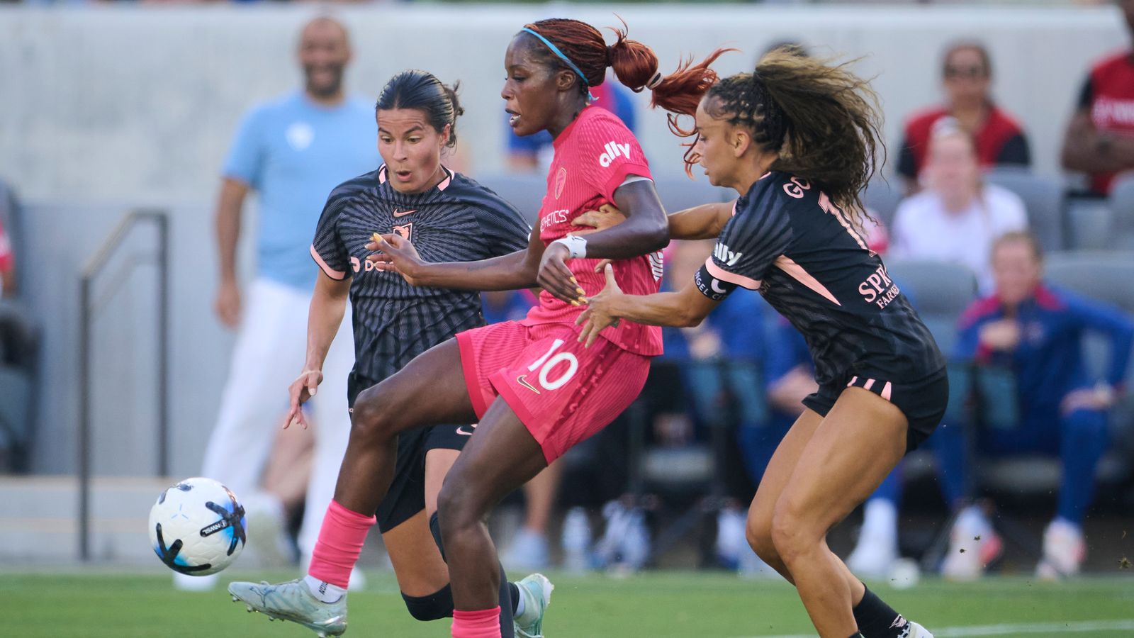 Sarah Gorden and Emily Sams battle for possession in NWSL game