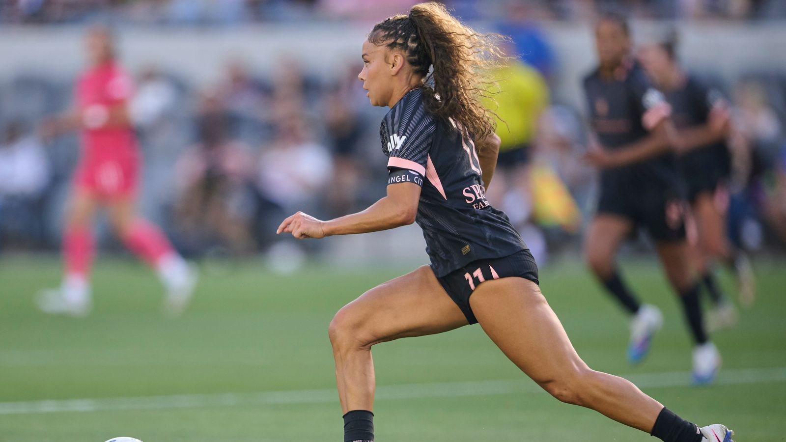 Sarah Gorden #11 of Angel City FC dribbles against NC Courage
