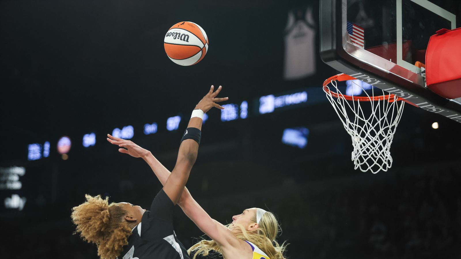 NaLyssa Smith attempts a lay-up against Cameron Brink's defense.
