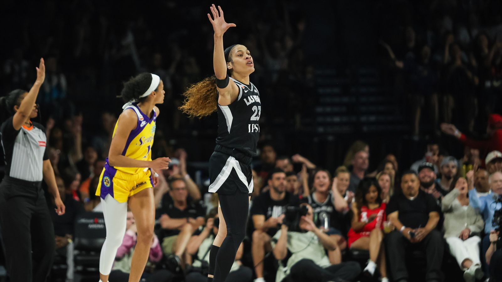 Chennedy Carter celebrates a three-pointer for the Aces.