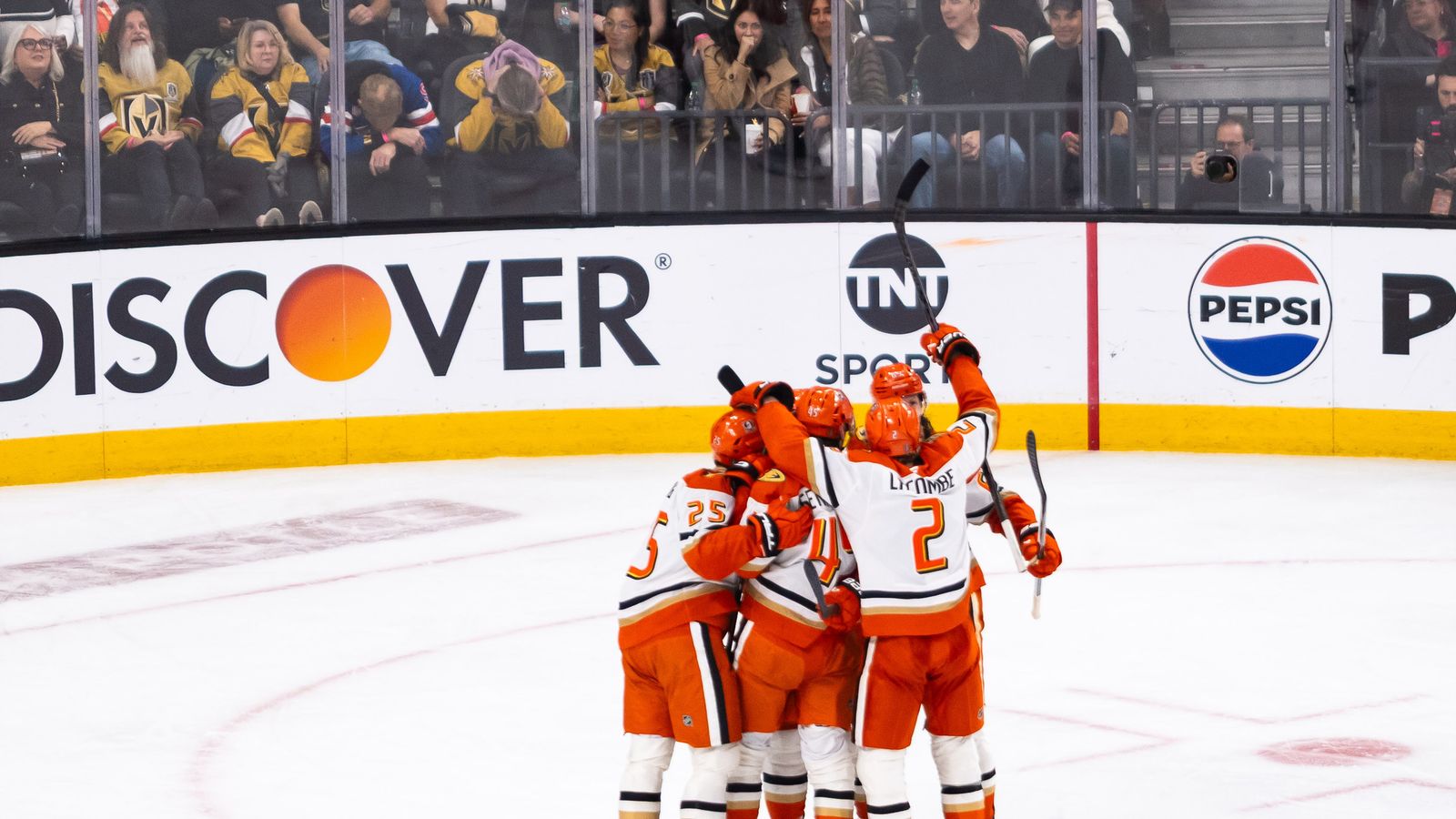 Ducks celebrate a goal by Beckett Sennecke in NHL playoff game