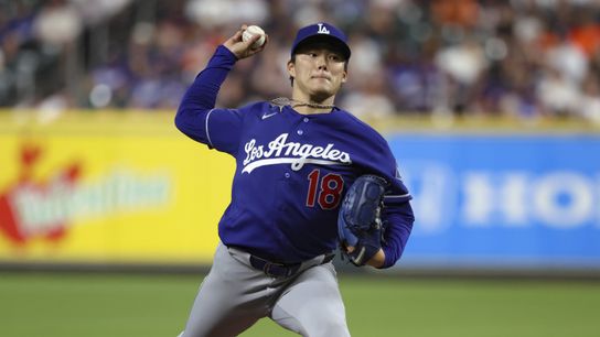 Yoshinobu Yamamoto pitches against the Astros at Daikin Park.