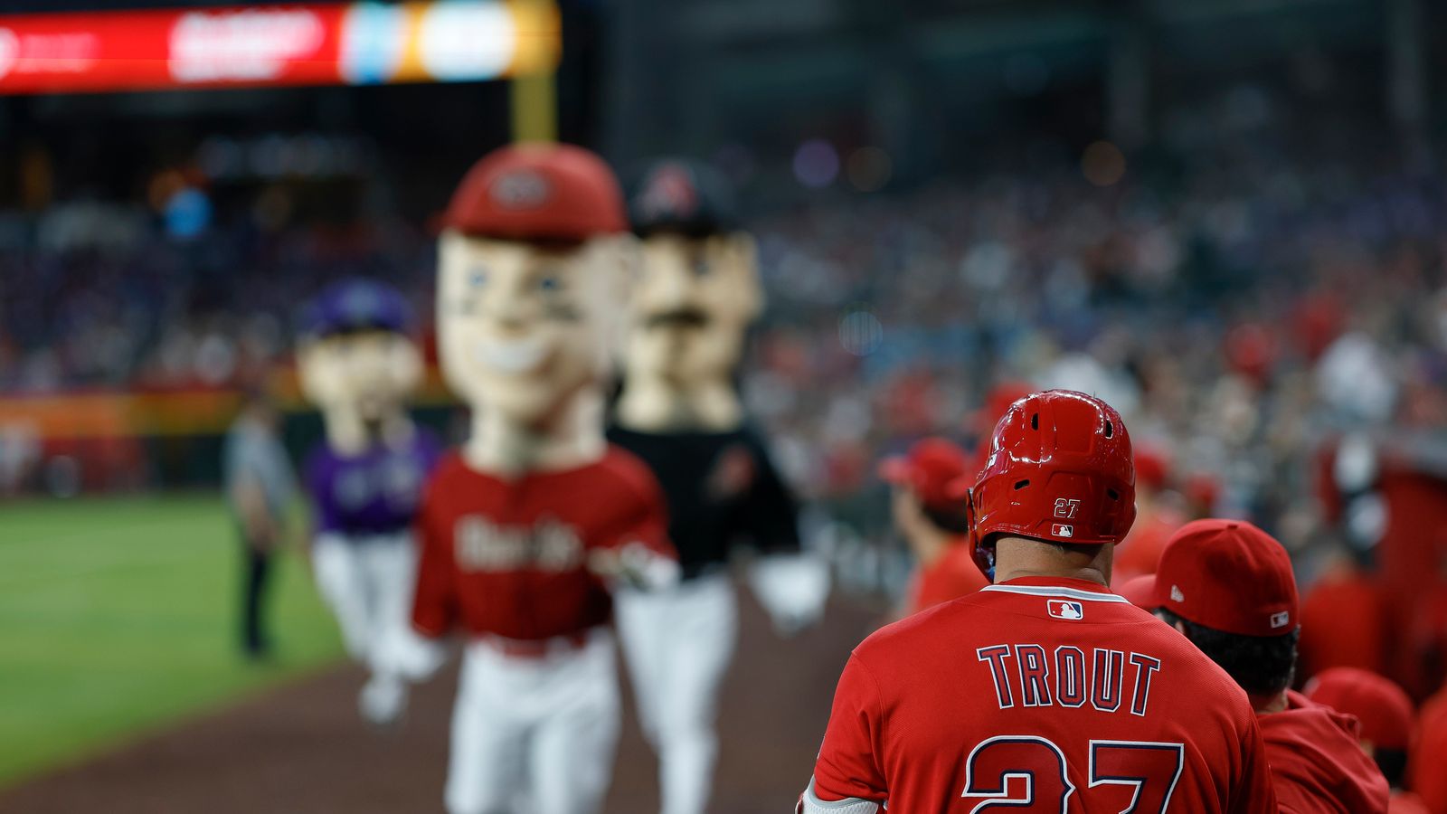 Mike Trout watches from the dugout at Chase Field, June 2026