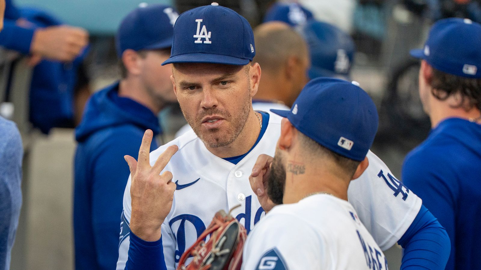 Freddie Freeman celebrates with Andy Pages in the dugout