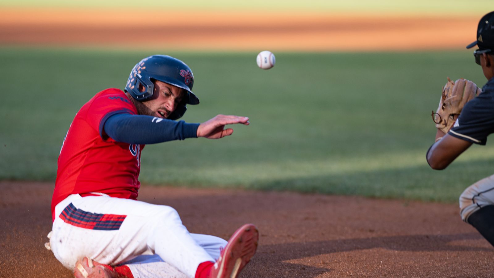 Jared Mettam slides into third base in NCAA regional game