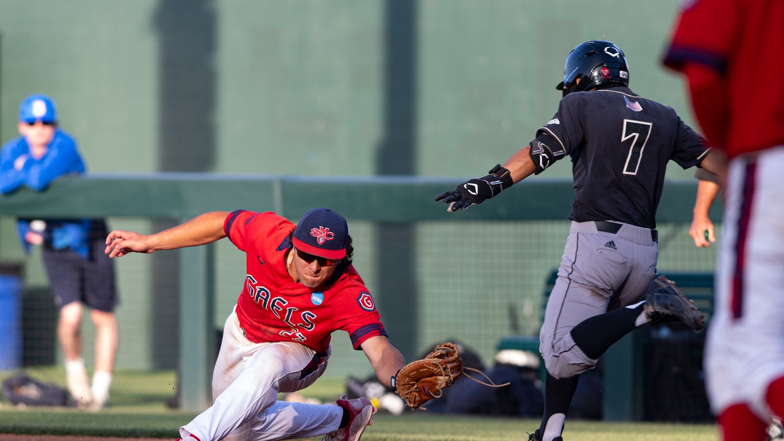 Makoa Sniffen catches at first base in NCAA regional game