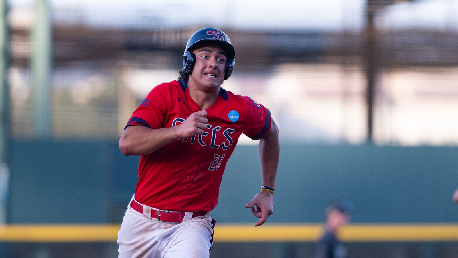 Makoa Sniffen runs to third base in NCAA regional game