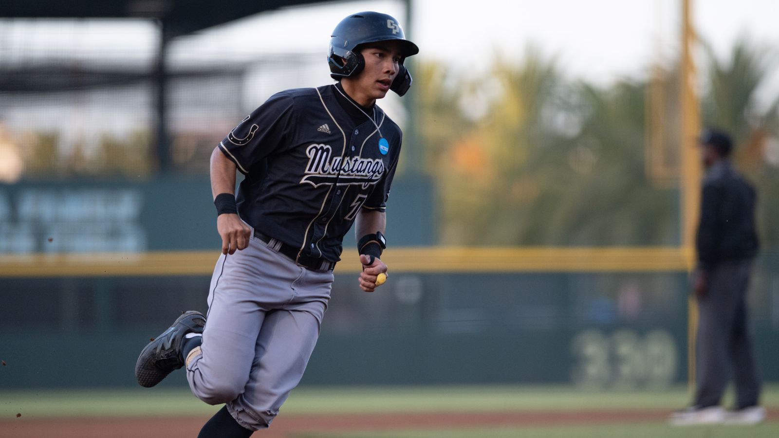 Nate Castellon runs to home plate in NCAA regional game