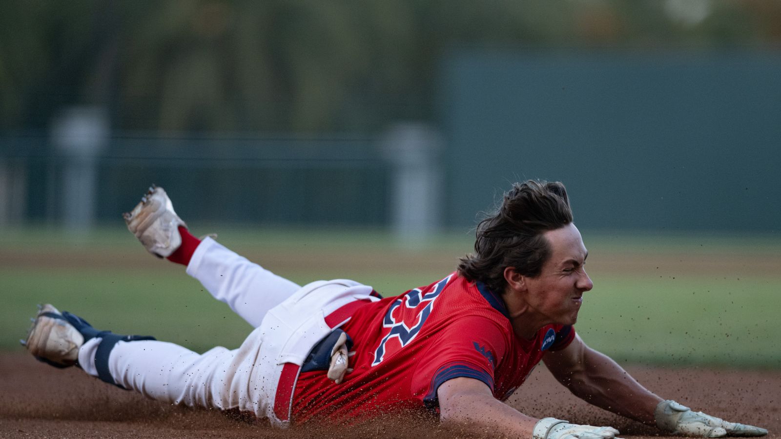 Tanner Griffith dives into third base in NCAA regional game