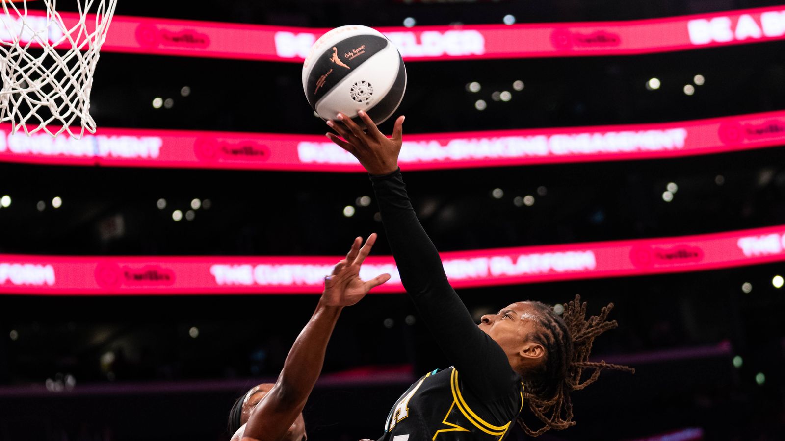 Ariel Atkins (7) drives towards the basket against the Aces.